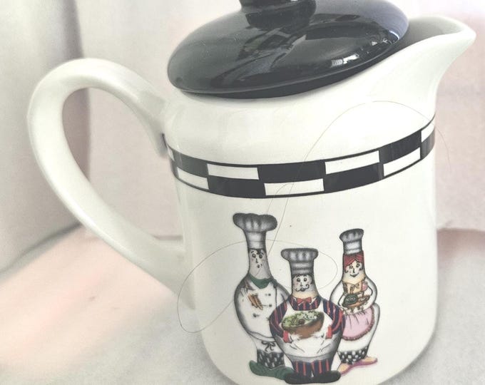 Trisa Holiday Porcelain Creamer with Lid featuring a Three Chef design. D6/17