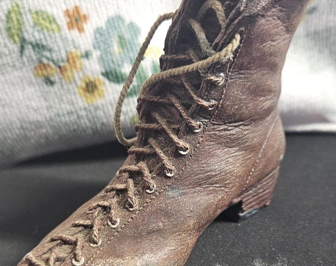 Vintage Victorian lace-up work boot figurine, slightly tilted to one side. C7/20