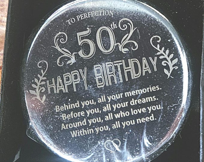 This compact mirror is a great 50th birthday gift for women. It's made of stainless steel and comes in a gift box. (Shelf)