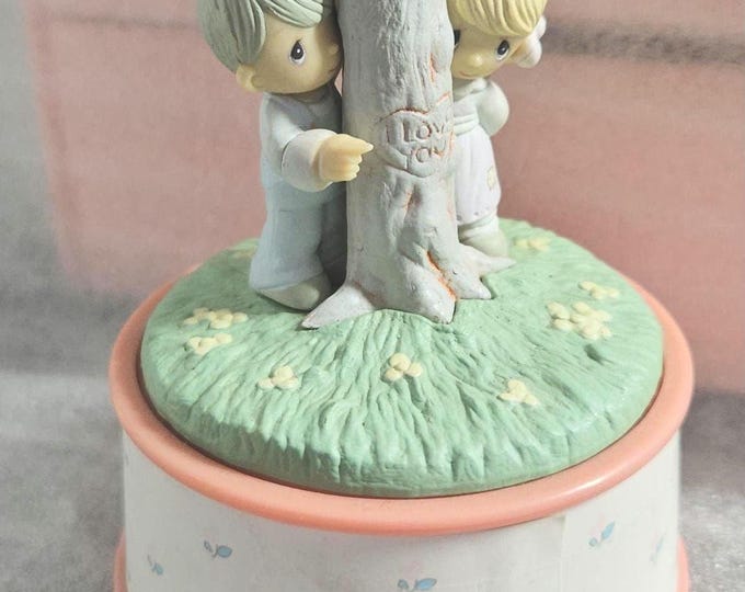 1989 Samuel J Butcher  Precious Moments collection music box which Plays “True Love”
