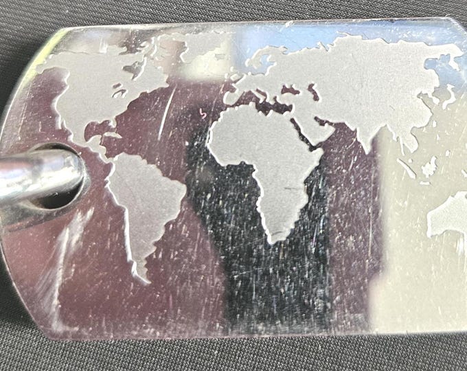 Simmons Jewelry Co. New World Map Stainless Steel Large Dog Tag. (Shelf)