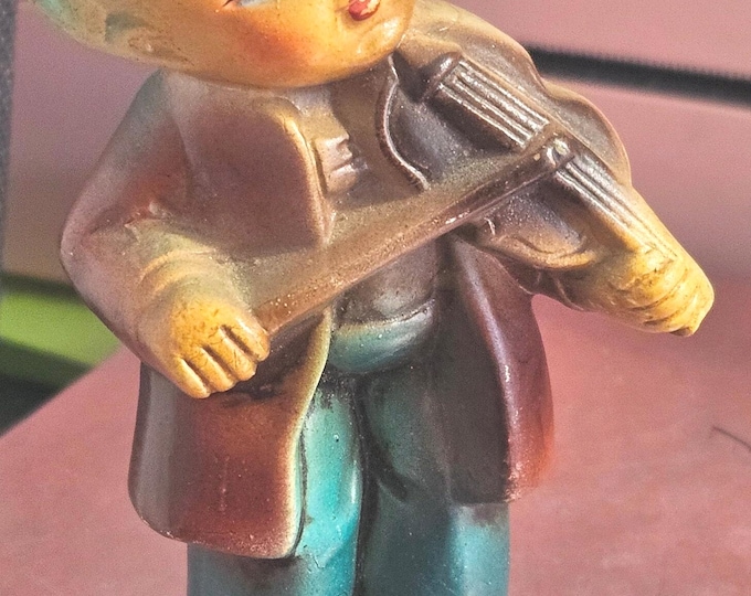 Hummel-style musical figure of a child, made in Japan. C7/16.
