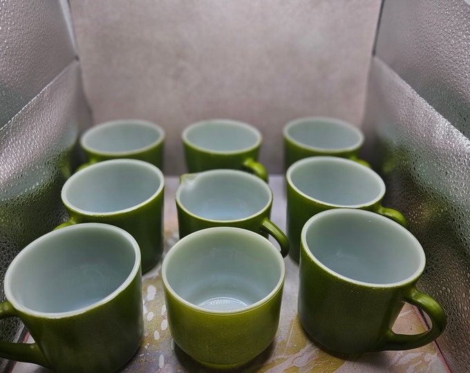 This vintage Federal glass set includes seven coffee mugs, a sugar bowl, and a creamer. lime green glass and each holds eight ounces B3/18