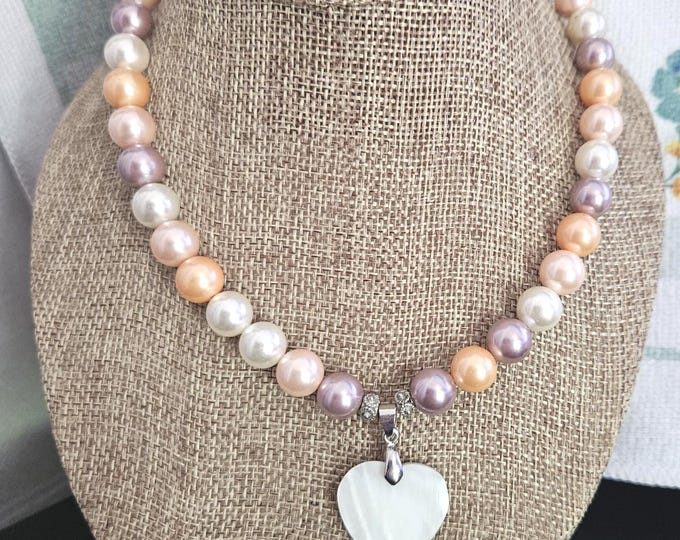 Vintage natural pearl necklace featuring white, orange, and purple colors, with a heart stone pendant and classic clasp, measuring 16 inch.