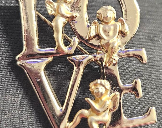 Religious love angel brooch with a gold tone. (BOX)