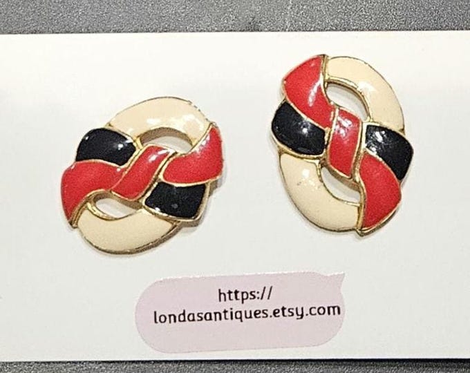 Vintage red, black, and white pierced earrings with gold trim.