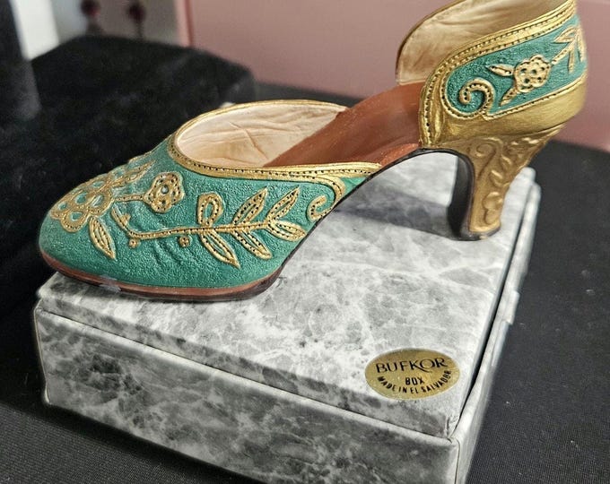Just the right shoe: "Carved Heel," 1999. Miniature green shoe #25096. C6/14