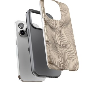 May include: A beige and brown phone case with a wavy line pattern. The case is shown with a silver phone.