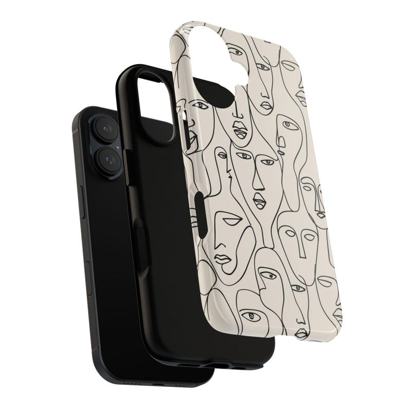 May include: A black smartphone with a protective case featuring a cream-colored background and a repeating line art design of faces. The case is detached, showing the phone's camera.