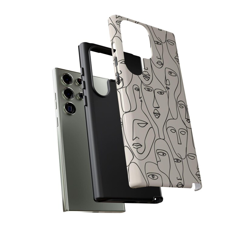 May include: A smartphone and two protective cases. One case is black, the other is white with a repeating line art face design. The phone is silver with multiple camera lenses.