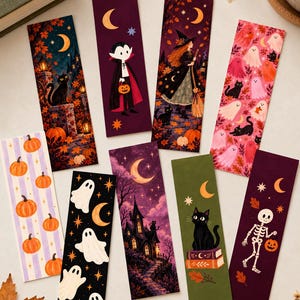 May include: A collection of nine rectangular bookmarks featuring Halloween-themed illustrations including a black cat, a vampire, a witch, ghosts, pumpkins, a haunted house, and a skeleton, all set against various colorful backgrounds with moons and stars.