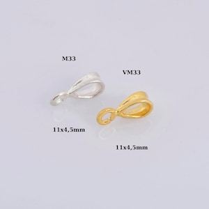 May include: Two silver and gold pendant bails, each measuring 11x4.5mm. The silver bail is labeled M33 and the gold bail is labeled VM33.