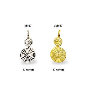 May include: Two silver and gold pendants with a spiral design. The pendants are 17mm by 8mm. The silver pendant is labeled M1157 and the gold pendant is labeled VM157.