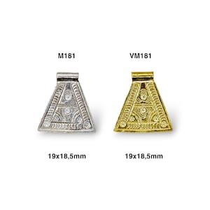 May include: Two triangular pendants, one silver and one gold, with an ornate design and the letter "A" in the center. Both pendants measure 19x18.5mm. The silver pendant is labeled "M181" and the gold pendant is labeled "VM181".