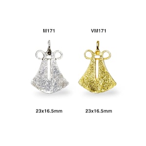 May include: Two silver and gold pendants shaped like a bell with a loop at the top. The pendants are 23x16.5 mm. The silver pendant is labeled M1171 and the gold pendant is labeled VM1171.