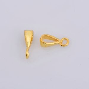 May include: Two gold-toned metal pendant bails. One bail has a loop at the top and the other has a hook at the bottom.