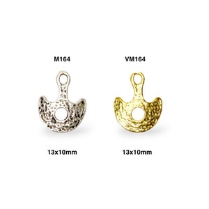 May include: Two metal charms in the shape of a crescent moon with a hole in the center. The charm on the left is silver and the charm on the right is gold. Both charms are 13mm x 10mm.