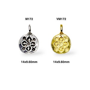 May include: Two silver and gold pendants with a floral design. The pendants are 14x9.60mm in size. The silver pendant is labeled M172 and the gold pendant is labeled VM172.