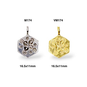 May include: Two hexagonal pendants with a snowflake design. The pendant on the left is silver and the pendant on the right is gold. Both pendants are 16.5 x 11 mm.