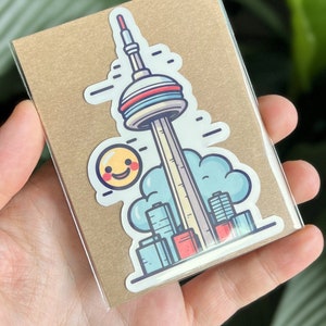 Autocollant souvenir de la Tour CN de Toronto. Joli autocollant en vinyle, soleil souriant, horizon de Toronto, souvenir de la tour CN.