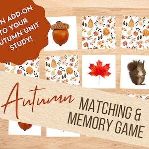 May include: A set of autumn-themed matching and memory game cards. The cards feature images of an acorn, a red maple leaf, a squirrel, and a pattern of autumn leaves, apples, and pumpkins.