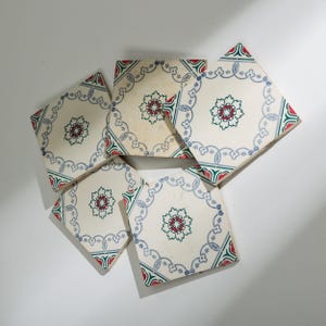 May include: A trio of ceramic mugs with a speckled, matte finish in cream, light grey, and dark grey. Each mug features a minimalist design and a rounded handle.