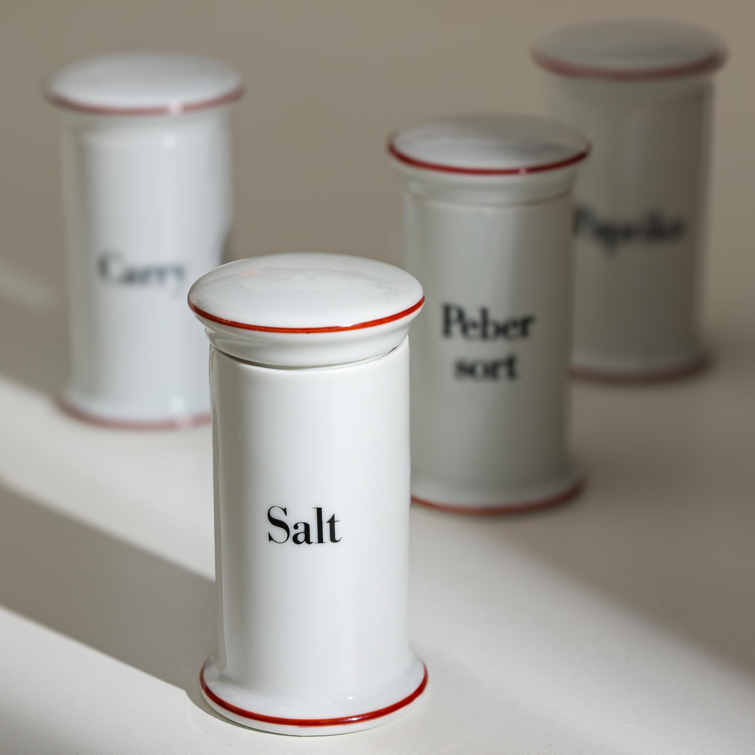 A set of 4 porcelain Bing & Grøndahl spice jars No 497 from the Apothecary Series designed by Bo Bonfils in the 1970’s Denmark