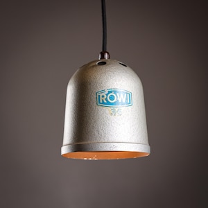 A one of a kind pendant lamp made out of a vintage darkroom photo enlarger by Rowi International 1960’s