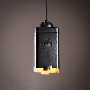 A one of a kind pendant lamp made out of a vintage darkroom photo enlarger by Zeiss Ikon 1930’s