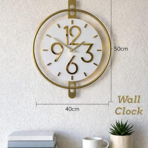 Väggklocka i guldfärgad metall med LED-bakgrundsbelysning, tyst skandinavisk design, vit rund urtavla, 40 x 50 cm