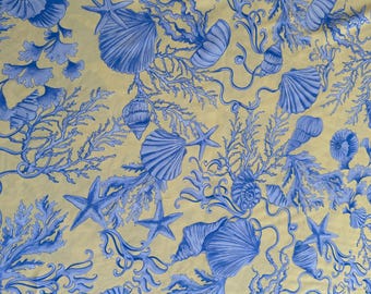 High-quality Italian 100% mulberry silk satin fabric, stretch, top quality, maritime designer print in blue with a beige and gold background.