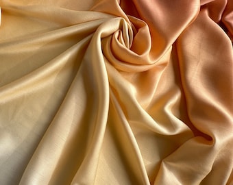 Italian viscose satin fabric, warm pastel transitional colors from ivory to peach-gold, good quality! 2 last pieces: 1.50 m, 1.35 m