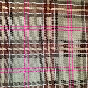 May include: A close-up of a plaid fabric with a green, brown, and white base and pink stripes.