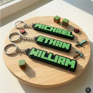 Aangepaste sleutelhanger met pixelnaam – blokletterbagagelabel – kinderrugzakbedel
