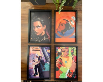 May include: Four framed art prints featuring stylized illustrations. One depicts a woman with purple eyes, another a person with headphones and the text "GET IT!!", a third shows a person on a rooftop, and the last has a person with colorful paint.