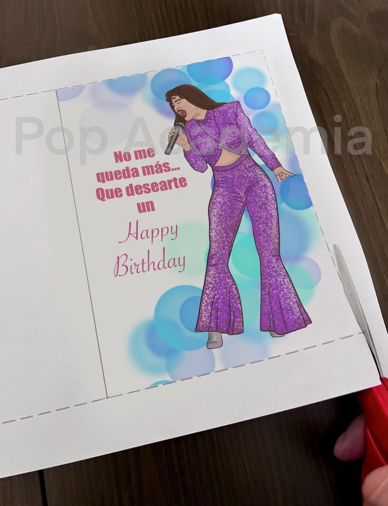 May include: A birthday card featuring a cartoon illustration of a woman singing into a microphone. The card has a blue and purple background with the text "No me queda m&aacute;s... Que desearte un Happy Birthday".