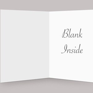 May include: A blank white card with the text "Blank Inside" written on the inside.