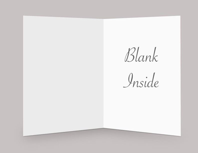 May include: A blank white card with the text "Blank Inside" written on the inside.