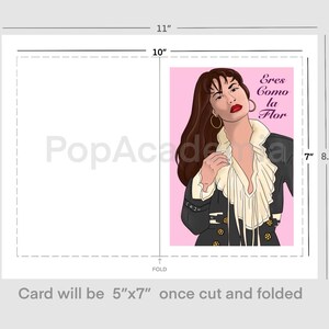 May include: A pink and white card with a drawing of Selena Quintanilla in a black jacket and white blouse. The text on the card reads "Eres Como la Flor".