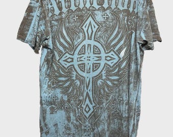 May include: A distressed gray and blue t-shirt with a large cross and wing design on the back. The word "Affliction" is printed across the top. The shirt has a worn, vintage look.