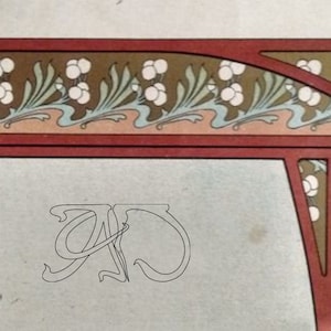 May include: A vintage illustration with a decorative border featuring a floral design with white flowers and green leaves. The border is framed in red and brown. The center of the image features a white background with a stylized letter "A" in the center.