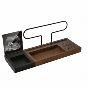 May include: A wooden desk organizer with a black metal pen holder and a black and white sonogram photo. The organizer has a dark brown wooden base with a carved-out section and the text "Happy Valentine's Day for Alex".