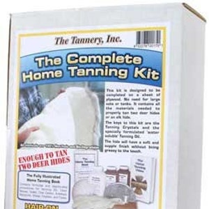 May include: A white box with the text "The Tannery, Inc. The Complete Home Tanning Kit" on the front. The box also says "Enough to tan two deer hides" and "Hair-on Leather Tanning".