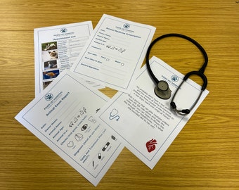May include: A set of four white papers with the text "PAWS VET HOSPITAL" and a black stethoscope. The papers are forms for animal appointments, exams, and prescriptions. One paper has a red heart icon and the text "You probably don't have a real stethoscope and live animal at home to examine..."