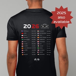 May include: Black t-shirt with a white graphic listing Formula 1 race dates and locations for 2026. The shirt also has a red starburst graphic that says "2025 also available".
