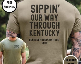 May include: A heather olive t-shirt with the text "Sippin' Our Way Through Kentucky" and "Kentucky Bourbon Tour 2025".