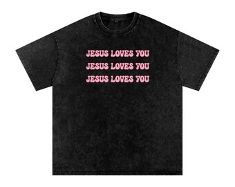 May include: Black t-shirt with a faded look and the text "JESUS LOVES YOU" repeated three times in pink.