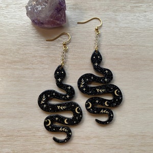 Celestial Serpent Earrings, black and gold, edgy, glittery snake danglies, witchy jewelry