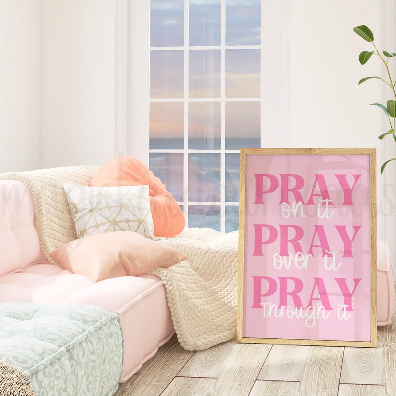 May include: Pink framed wall art with the text "Pray on it, Pray over it, Pray through it".