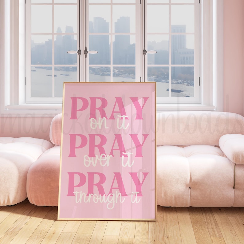 May include: Pink and white motivational quote print with the text "Pray on it, Pray over it, Pray through it".